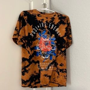 Large tie-dye graphic T-shirt with “positive energy “design burnt orange & black